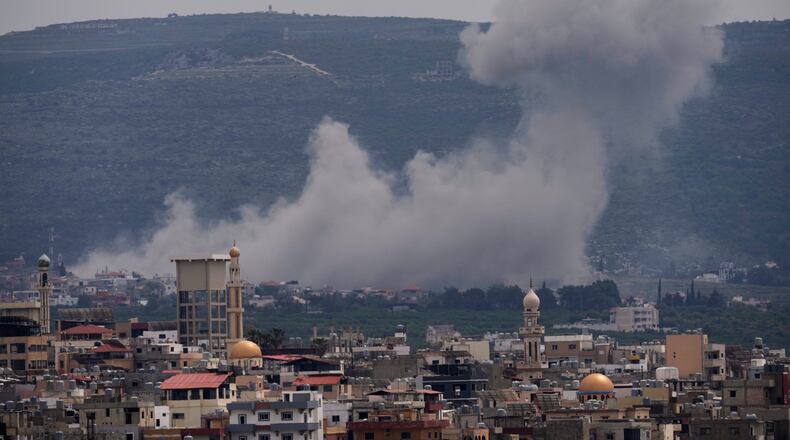 Smoke rises following an Israeli airstrike on the village of Qlaileh, as seen from the southern port city of Tyre, Lebanon, Wednesday, April 15, 2026. (AP Photo/Hussein Malla)