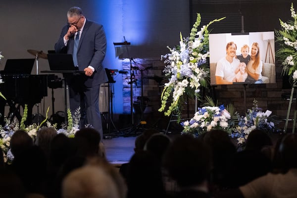 The Rev. Jeff Hickman pauses while leading the funeral of Nic Crews at North River Church of Christ in Marietta on Sunday, March 22, 2026. (Ben Gray for the AJC)