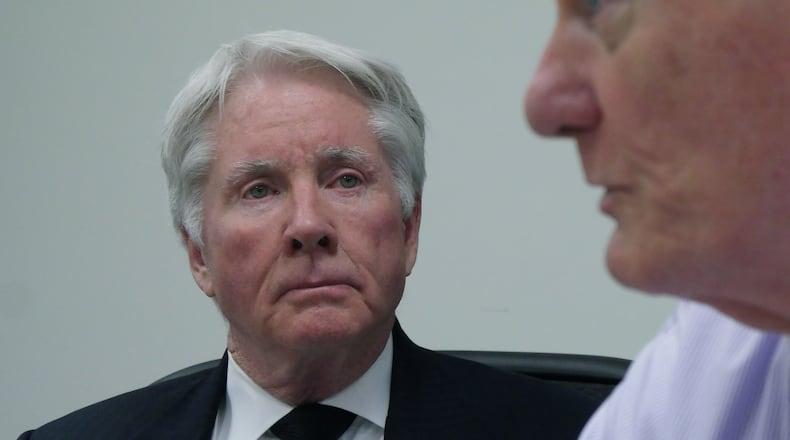November 17, 2016 Decatur - Claud “Tex” McIver looks as his lawyer Steve Maples speaks on Thursday, November 17, 2016. McIver, an Atlanta lawyer, said he accidentally shot his wife Diane McIver Sunday, Sept. 25, while the couple headed home in their SUV. HYOSUB SHIN / HSHIN@AJC.COM