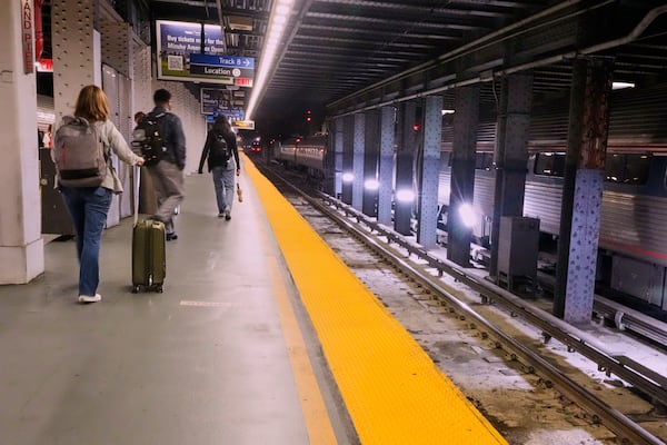 Amtrak passengers arrive at Penn Station in New York, Friday, May 16, 2025. (AP Photo/Richard Drew)