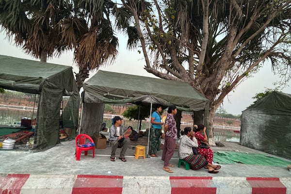 Victims rest near temporary tents distributed by Myanmar military near Mandalay palace in the aftermath of Friday's earthquake in Mandalay, Myanmar, Wednesday, April 2, 2025. (AP Photo)
