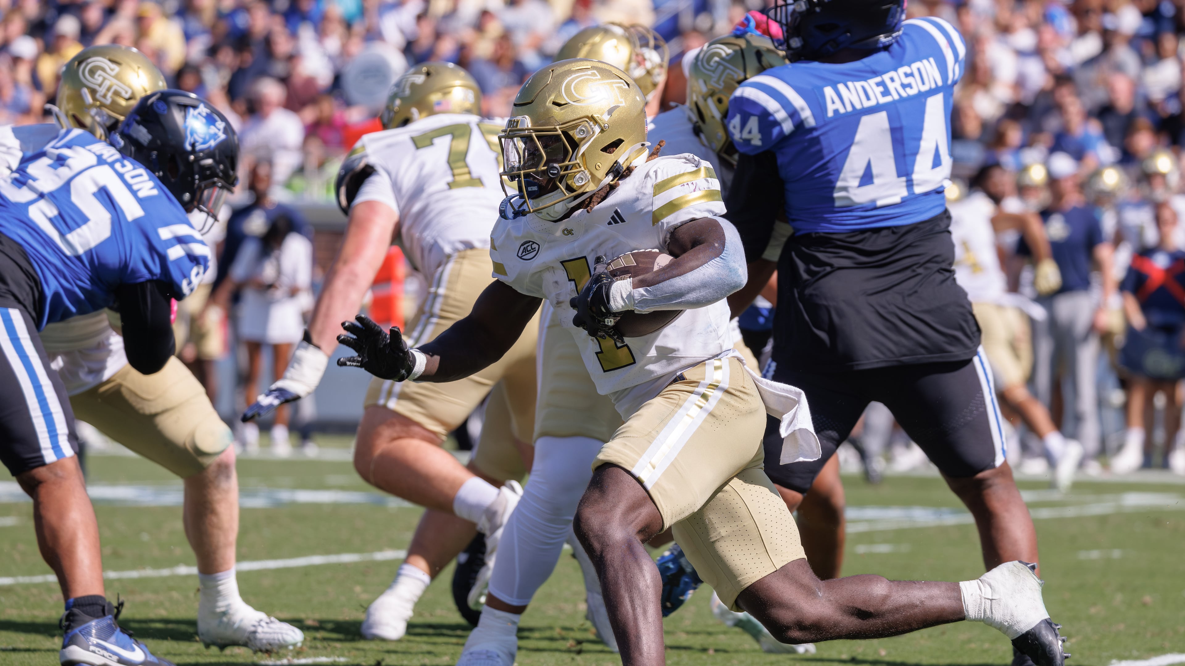 Georgia Tech's Jamal Haynes (center) carries the ball during the first half against Duke in Durham, N.C. on Saturday, Oct. 18, 2025. Haynes and the Yellow Jackets have averaged 3.025 million viewers for its four games on ESPN this season. (Ben McKeown/AP)