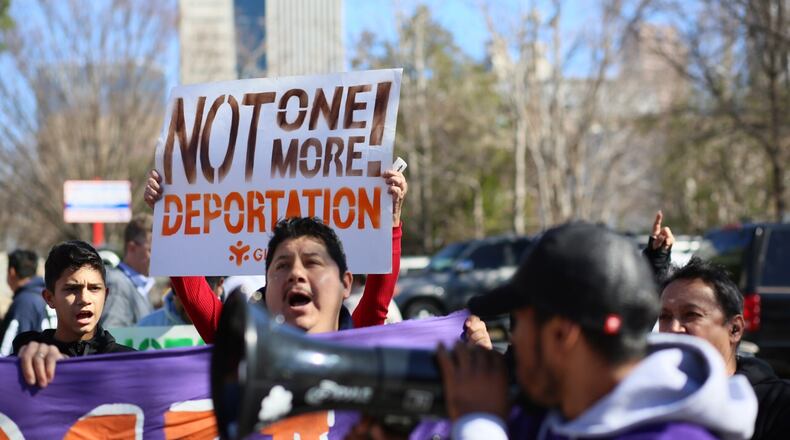 Dozens of people gathered outside federal offices in Atlanta in February, part of a strike called ‘a day without immigrants.”Miguel Martínez/MundoHispanico