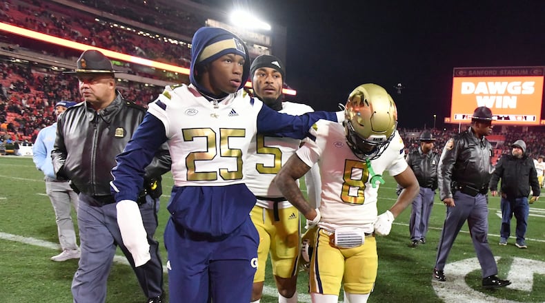 Georgia Tech players leave the football field after Georgia won 44-42 over Georgia Tech in eight overtimes during an NCAA football game at Sanford Stadium, Friday, November 29, 2024, in Athens. (Hyosub Shin / AJC)