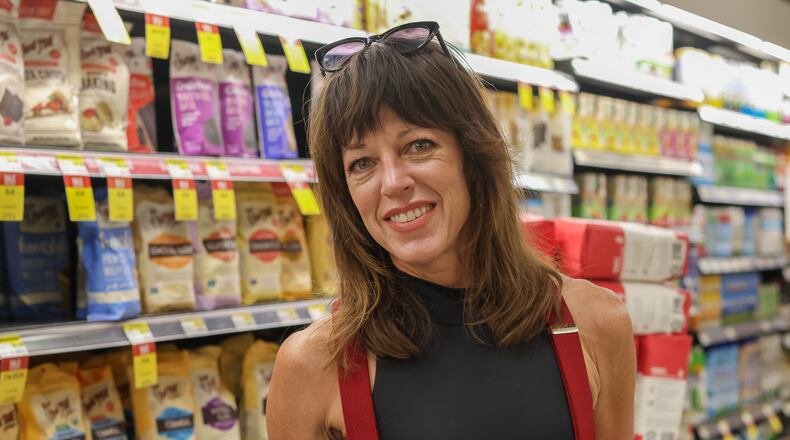 Julie Allen, 47, from Athens, Georgia is the founder and coordinator of the #BakeWithMe project which connects bakers from the Athens community to make and donate bread for those in need. Allen poses for a portrait in Earth Fare in Athens, Georgia on Monday, Nov. 6, 2023.  (Photo Courtesy of Samantha Hurley)