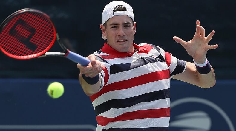 John Isner returns a forehand to Mischa Zverev of Germany during the BB&T Atlanta Open at Atlantic Station on July 27, 2018. (Photo by Kevin C. Cox/Getty Images)
