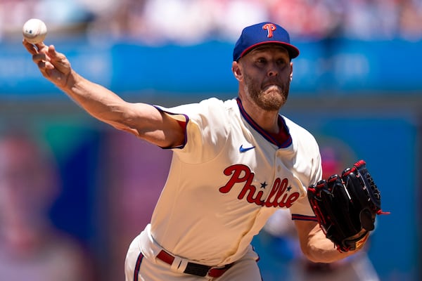 Philadelphia Phillies starting pitcher Zack Wheeler delivers during the first inning of a baseball game against the Cincinnati Reds, Sunday, July 6, 2025, in Philadelphia. (AP Photo/Chris Szagola)