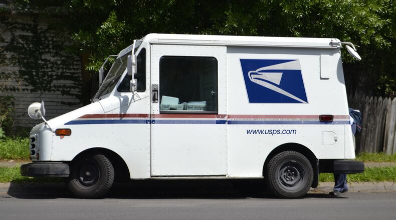 Two Ohio U.S. postal workers are facing charges related to allegedly stealing drugs and money from a Dayton-area mail distribution center.