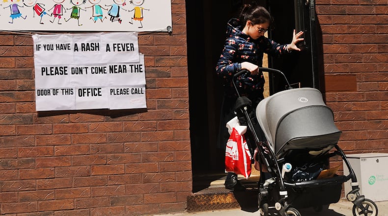 A sign warns people of measles in the ultra-Orthodox Jewish community in Williamsburg in New York City. As a measles epidemic continues to spread, New York City Mayor Bill de Blasio recently announced a state of emergency and mandated residents of the ultra-Orthodox Jewish community in Williamsburg at the center of the outbreak to get vaccinated for the viral disease. Those who choose not to will risk a $1,000 fine. SPENCER PLATT / GETTY IMAGES