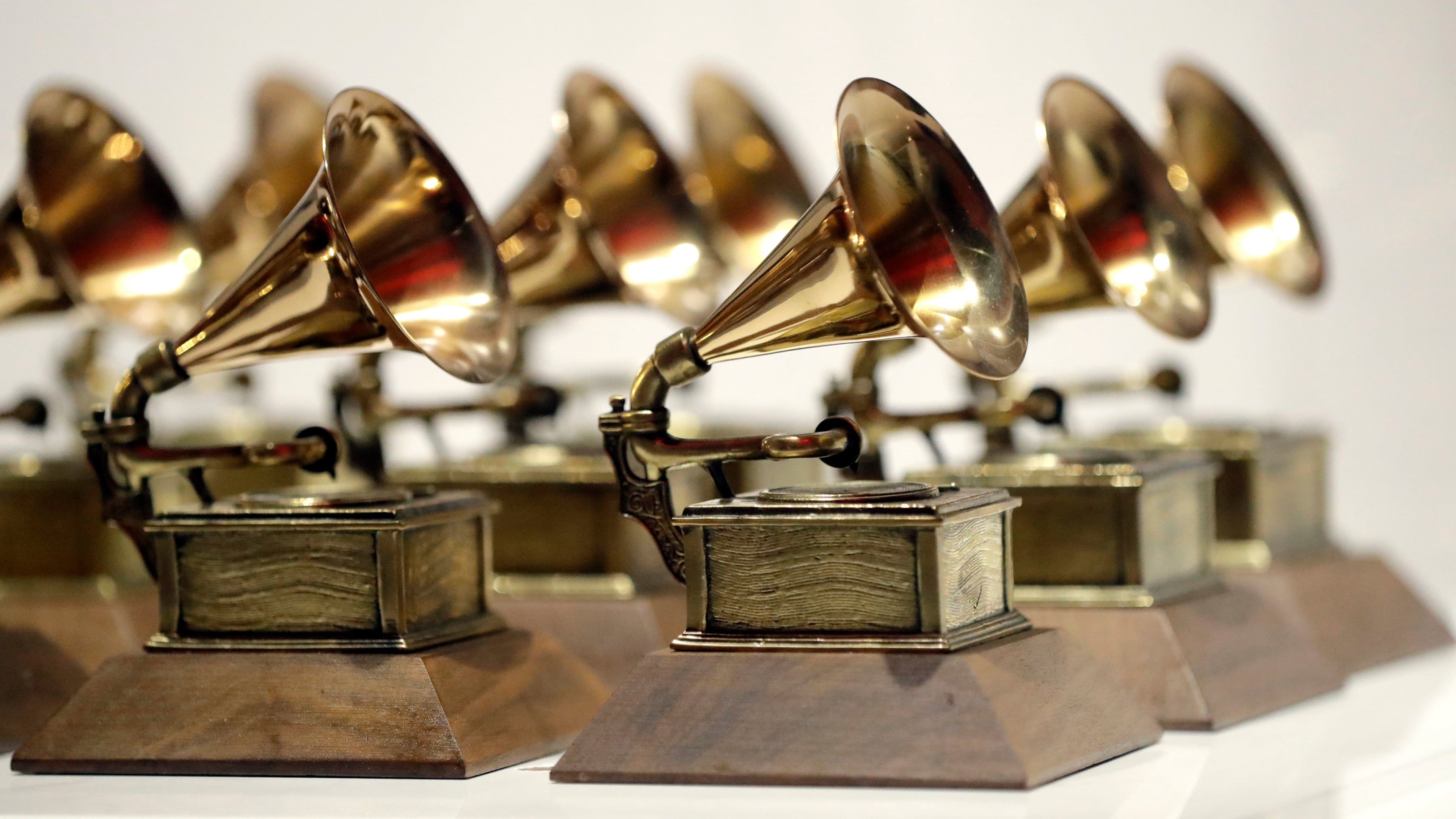 FILE - Grammy Awards are displayed at the Grammy Museum Experience at Prudential Center in Newark, N.J. on Oct. 10, 2017. (AP Photo/Julio Cortez, File)