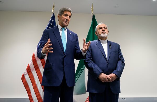 FILE - US Secretary of State John Kerry, left, speaks during a meeting with Iranian Foreign Minister Mohammad Javad Zarif at United Nations headquarters, Sept. 26, 2015. (AP Photo/Craig Ruttle, File)