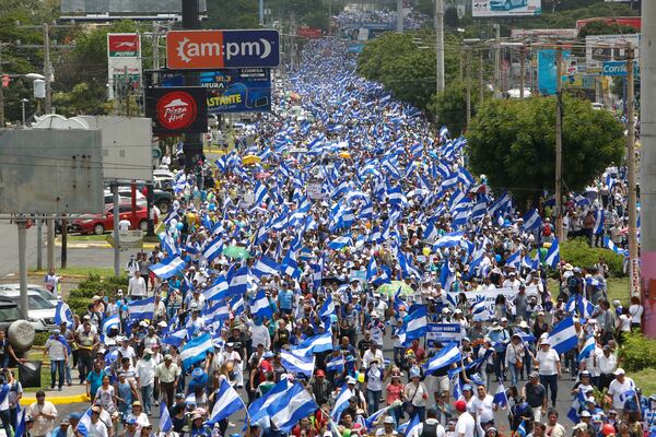 FILE - Hundreds of thousands participate in a demonstration called the "March of the Flowers" remembering the children killed during the last two-months of protests, in Managua, Nicaragua, on June 30, 2018. (AP Photo/Alfredo Zuniga, File)