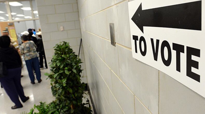 Voters wait in line at the Adamsville Recreation Center, an early voting site, in Atlanta on Friday, May 2, 2014.