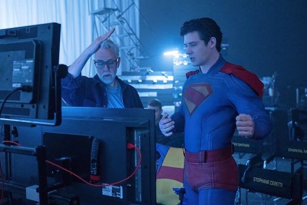 This image released by Warner Bros. Pictures shows David Corenswet, right, and director James Gunn on the set of "Superman." (Jessica Miglio/Warner Bros. Pictures via AP)