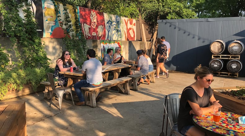 With an X marked out for social distancing, people enjoy a beer and snacks after walking the BeltLine at Wild Heaven Beer West End. 
Courtesy of Wild Heaven Beer