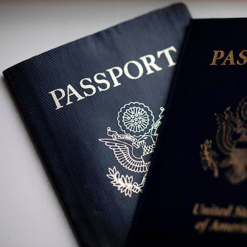 FILE - U.S. passports are arranged for a photograph in Tigard, Ore., Dec. 11, 2021. (AP Photo/Jenny Kane, File)