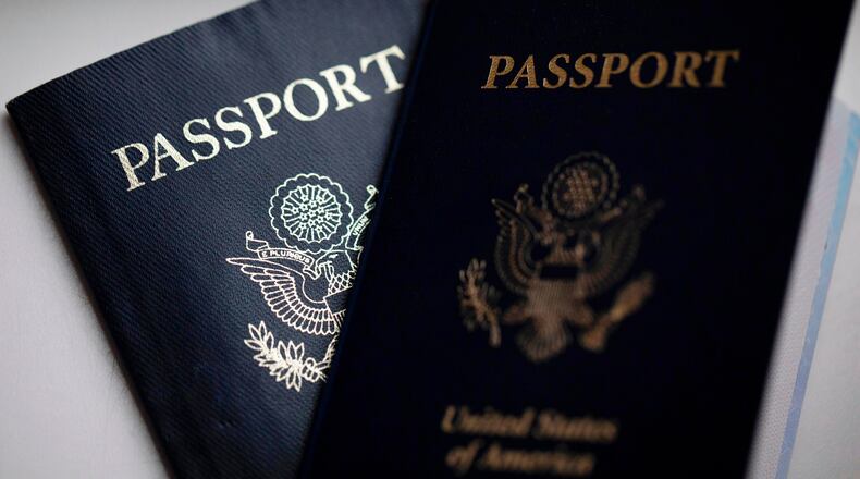 FILE - U.S. passports are arranged for a photograph in Tigard, Ore., Dec. 11, 2021. (AP Photo/Jenny Kane, File)