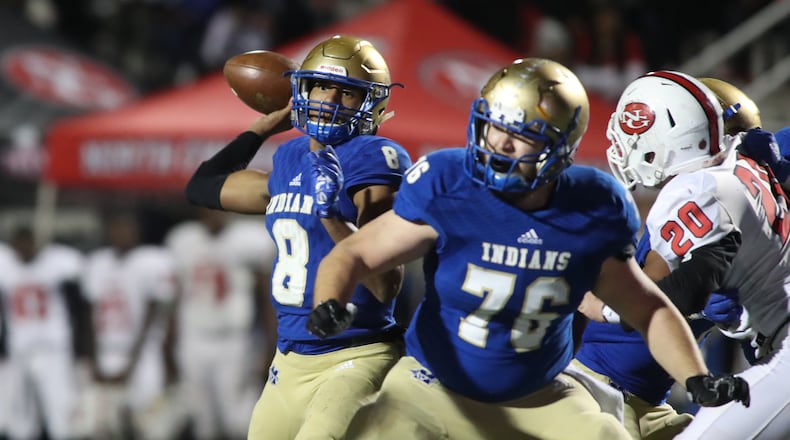 McEachern quarterback Carlos Del Rio (8) attempts a pass as center Taylor Hogan (76) blocks in the first half against North Gwinnett in the Class 7A quarterfinals at McEachern High School Friday, November 29, 2019 in Powder Springs, Ga. Del Rio left McEachern for Grayson but was declared ineligible Tuesday. (JASON GETZ/SPECIAL TO THE AJC)