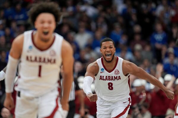 Alabama guard Chris Youngblood (8) and guard Mark Sears (1) react during the second half of a Sweet 16 round NCAA college basketball tournament game against Brigham Young, Thursday, March 27, 2025, in Newark, N.J. (AP Photo/Frank Franklin II)