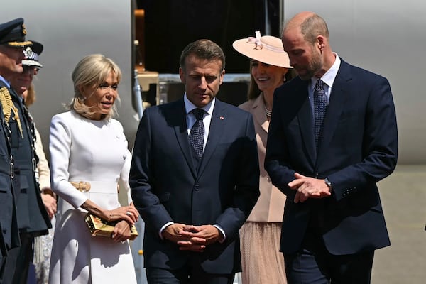 France's President Emmanuel Macron and his wife Brigitte Macron, left, are greeted by Britain's Prince William, right, and Kate, Princess of Wales at RAF Northolt, west of London, Tuesday July 8, 2025, on the first day of a three-day state visit to Britain. (Justin Tallis/Pool via AP)