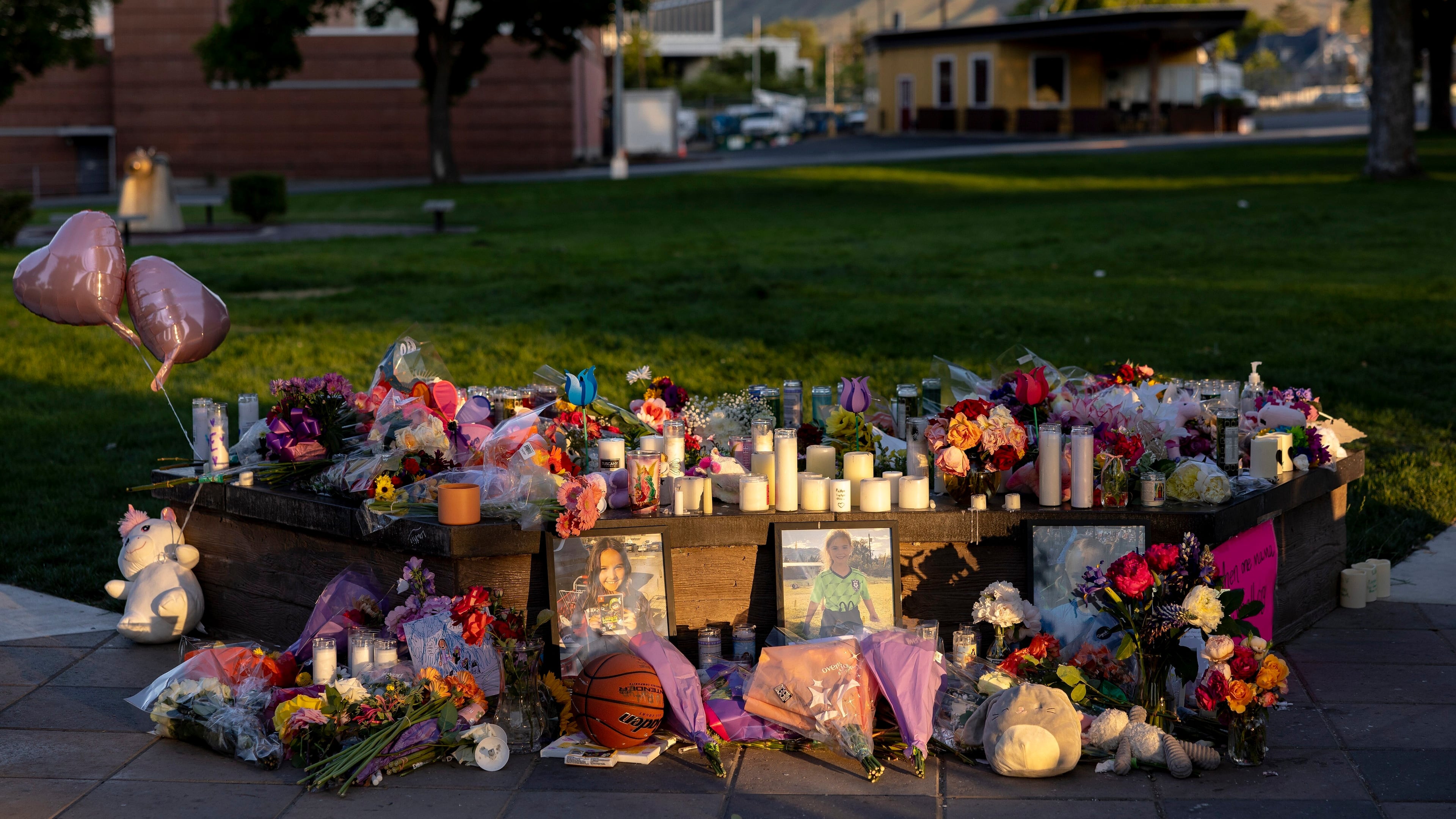 FILE - Pictures, flowers and candles mark a makeshift memorial, June 3, 2025, in Wenatchee, Wash., in honor of Olivia, Paityn and Evelyn Decker, who were found dead near Leavenworth after their father Travis Decker failed to return them after a scheduled visitation. (Nick Wagner/The Seattle Times via AP)
