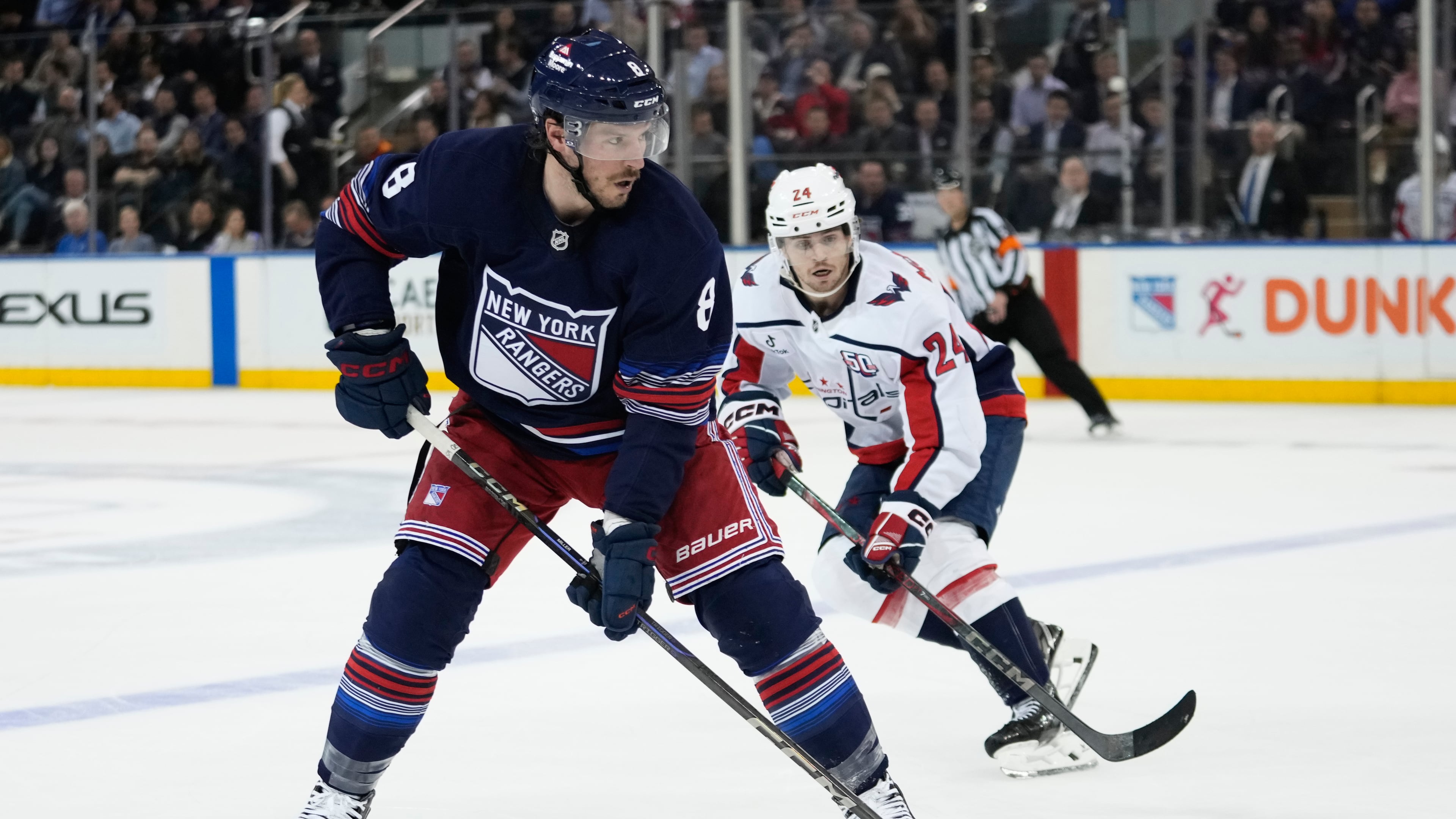 FILE - New York Rangers' J.T. Miller (8) drives past Washington Capitals' Connor McMichael (24) during the second period of an NHL hockey game Wednesday, March 5, 2025, in New York. (AP Photo/Frank Franklin II, File)
