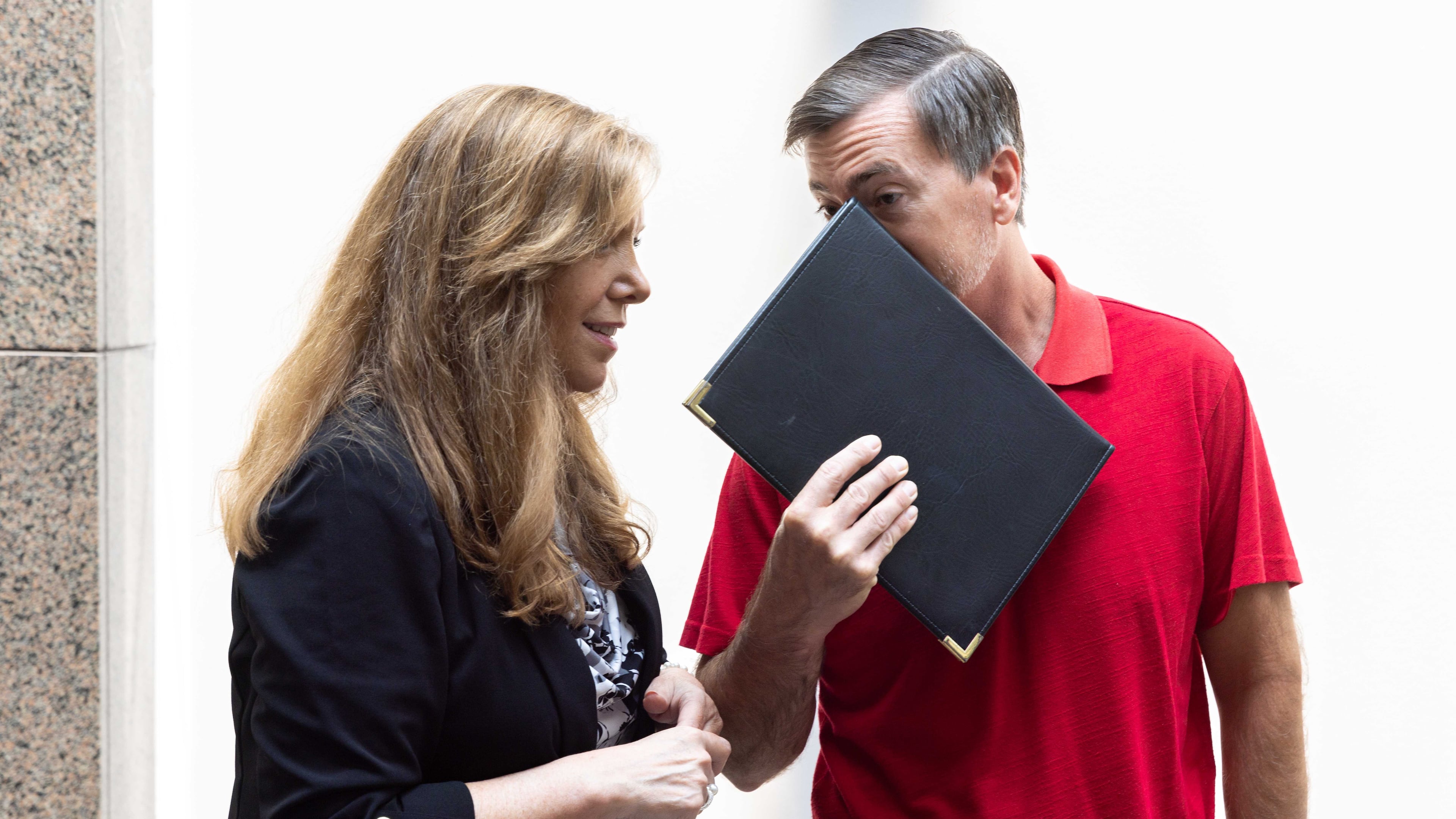 Republican Jason Frazier (right) speaks with a supporter after the public comment portion of the Fulton County Board of Commissioners meeting in Atlanta on Wednesday, June 7, 2023. A Fulton County judge ruled this week that Frazier and Julie Adams must be appointed to the county election board. (Arvin Temkar/AJC)