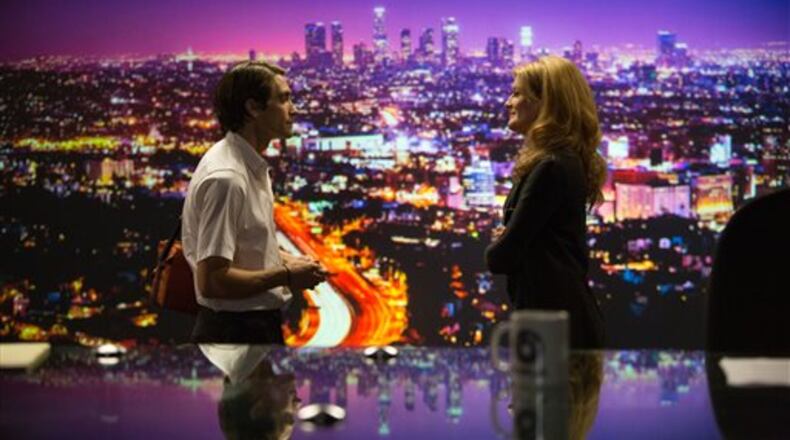 In this image released by Open Road Films, Jake Gyllenhaal, left, and Rene Russo appear in a scene from the film, "Nightcrawler." (AP Photo/Open Road Films, Chuck Zlotnick)