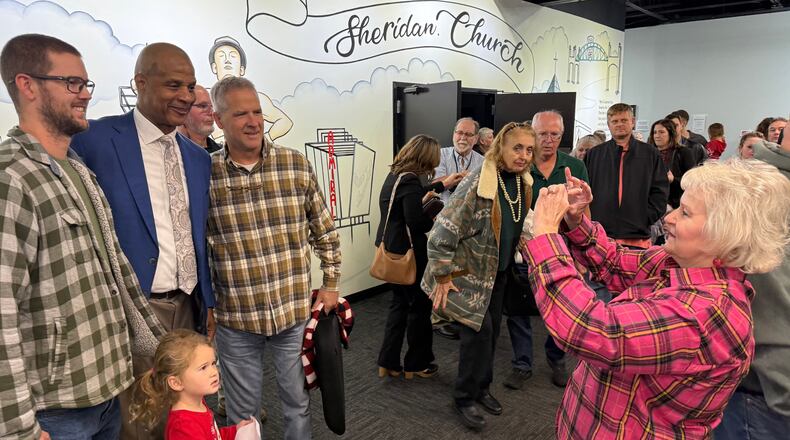 Former Major League baseball player Darryl Strawberry, second from left, poses with some of the people who heard him preach on Sunday, Nov. 23, 2025, at Sheridan Church, in Tulsa, Okla. (AP Photo/Bobby Ross)