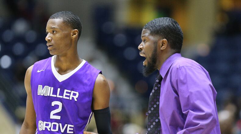 March 8, 2018 Macon: Miller Grove head coach Rasul Chester coaches up guard Timothy Stargell Jr. in the final minutes against Warner Robins in their GHSA state basketball championship game on Thursday, March 8, 2018, in Macon. Curtis Compton/ccompton@ajc.com