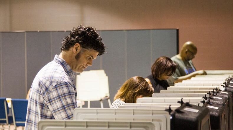 Cobb County residents take part in primary election voting at Noonday Baptist Church in Marietta, on Tuesday, May 22, 2018.