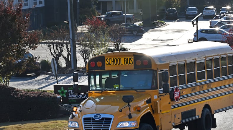 A Gwinnett school bus makes its way for drop offs in Duluth on Tuesday, November 7, 2023. Several metro Atlanta school districts are canceling in-person classes Tuesday because of anticipating freezing temperatures. (Hyosub Shin / Hyosub.Shin@ajc.com)
