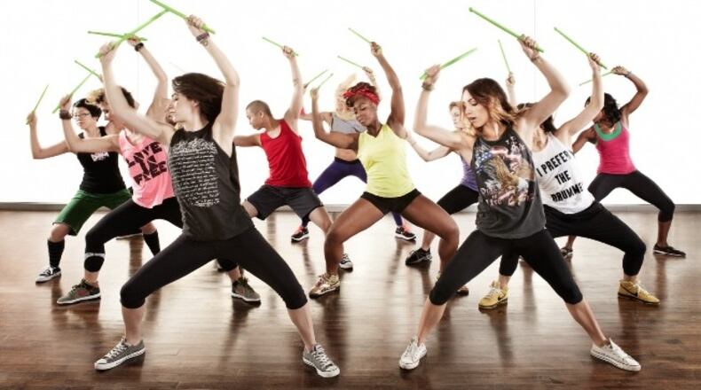 POUND fitness classes utilize weighted drumsticks in an intense calorie-burning workout.