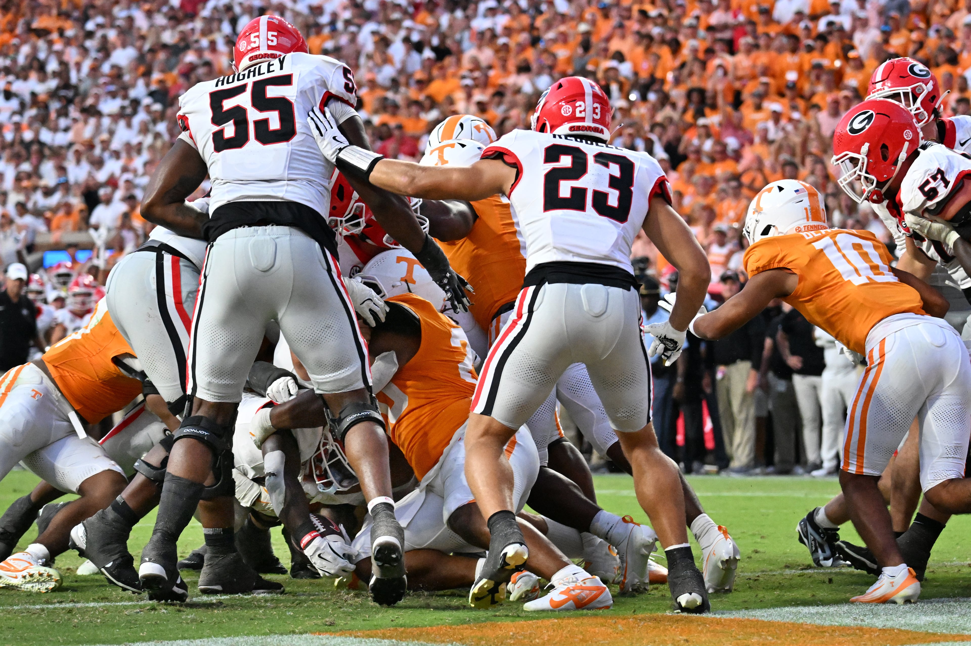 Georgia running back Josh McCray (bottom of pile) falls into the end zone for the game-winning touchdown during overtime against Tennessee at Neyland Stadium on Saturday, Sept. 13, 2025, in Knoxville, Tenn. Georgia won 44-41. (Hyosub Shin/AJC)