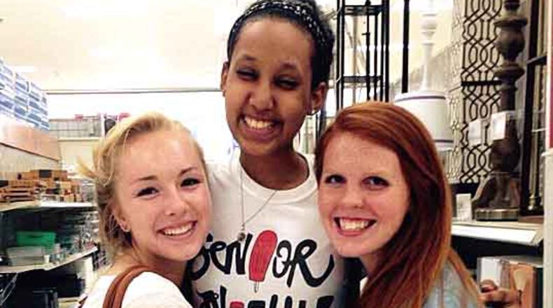 Miki Ghirmazghi, center, will be remembered for her constant smile, her UGA classmates said. Rebekah Livingston, left, and Janie Johnson, right, lived on Ghirmazghi’s hall as freshmen. (Special photo to the AJC)