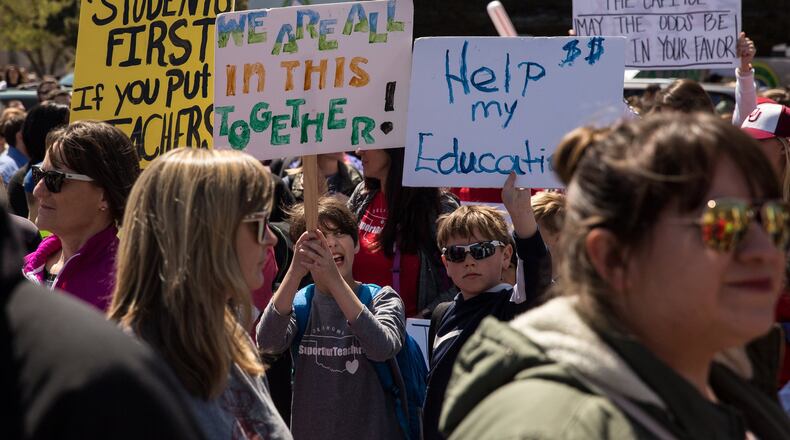 Thousands gathered and marched in a pitcket line outside the Oklahoma state Capitol building during the third day of a statewide education walkout on April 4, 2018 in Oklahoma City, Oklahoma. Teachers and their supporters are demanding increased school funding and pay raises for school workers. (Photo by Scott Heins/Getty Images)
