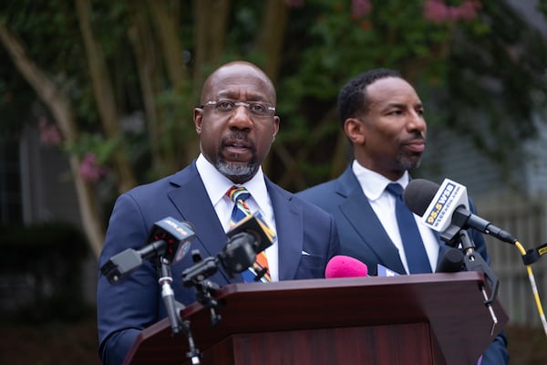 U.S. Sen. Raphael Warnock speaks to reporters during a news conference in Atlanta on Monday. (Ben Gray for the AJC)