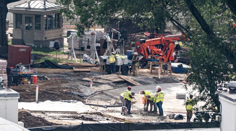Workers use a jackhammer on the helipad on the South Lawn of the White House, Wednesday, Aug. 5, 2026, in Washington. (AP Photo/Alex Brandon)