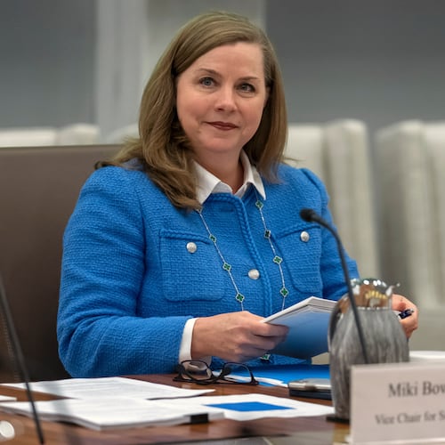 FILE - Michelle Bowman, Vice Chair for Supervision of the Federal Reserve Board of Governors, takes a seat for an open meeting of the Board of Governors at the Federal Reserve, in Washington, June 25, 2025. (AP Photo/Mark Schiefelbein, File)