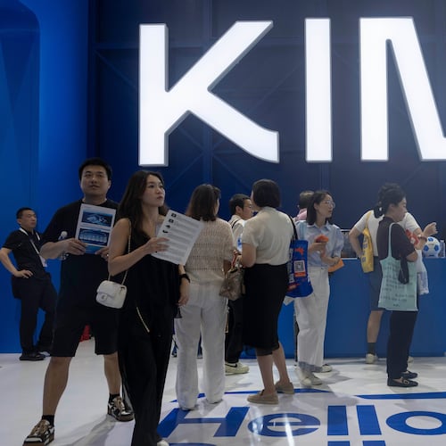 Visitors at the booth for Moonshot's Kimi K3 during World AI Conference in Shanghai, Friday, July 17, 2026. (AP Photo/Ng Han Guan)