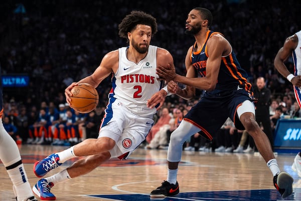 Detroit Pistons guard Cade Cunningham (2) drives toward the basket against New York Knicks' Mikal Bridges during the first half of Game 2 of an NBA basketball first-round playoff series, Monday, April 21, 2025, in New York. (AP Photo/Angelina Katsanis)
