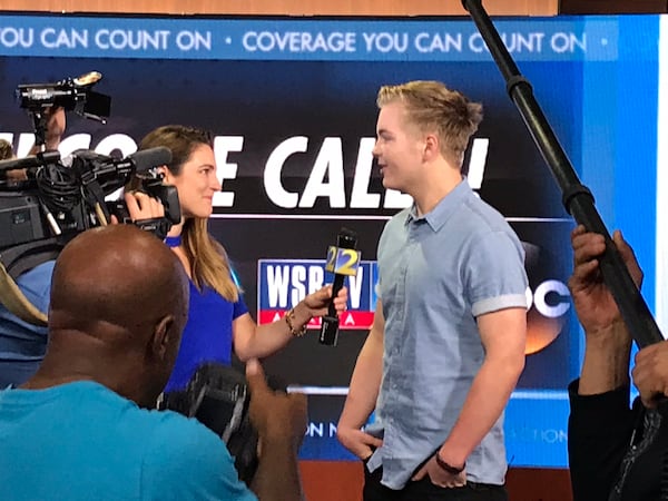  WSB multi-media journalist Heather Catlin talks to Caleb Lee Hutchinson in Studio C at WSB. CREDIT: Rodney Ho/rho@ajc.com