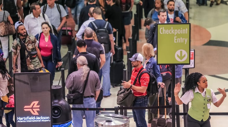Hartsfield-Jackson International Airport Thursday morning, May 24, 2018 as the Memorial Day travel holiday was underway. JOHN SPINK/JSPINK@AJC.COM
