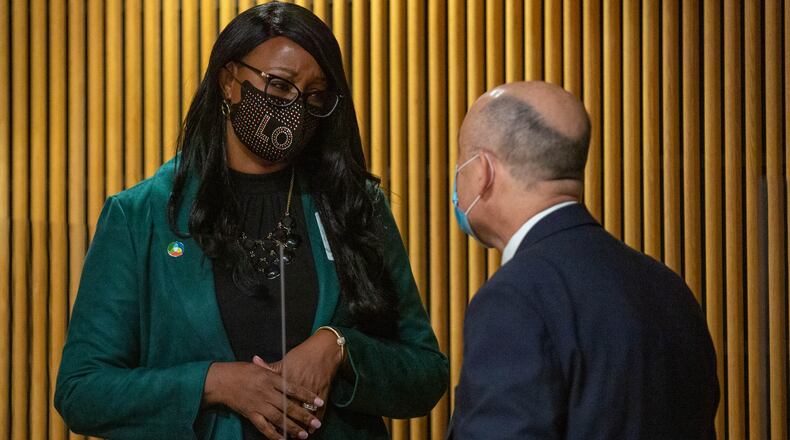 Chairwoman Nicole Hendrickson speaks to county attorney Mike Ludwiczak in January. Last week, Hendrickson ended a mask mandate in county buildings. (Rebecca Wright for the Atlanta Journal-Constitution) AJC FILE PHOTO