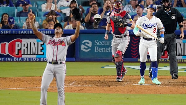 Braves relief pitcher Raisel Iglesias (left) strikes out the Dodgers’ Kiké Hernández as catcher Sean Murphy walks out to the mound Thursday, Aug. 31, 2023, in Los Angeles. The two teams face off during a three-game series at Dodger Stadium this weekend. (Mark J. Terrill/AP 2023)