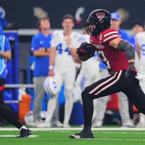 Texas Tech linebacker Ben Roberts intercepts a BYU pass in the second half of a Big 12 Conference championship NCAA college football game Saturday, Dec. 6, 2025, in Arlington, Texas. (AP Photo/Julio Cortez)