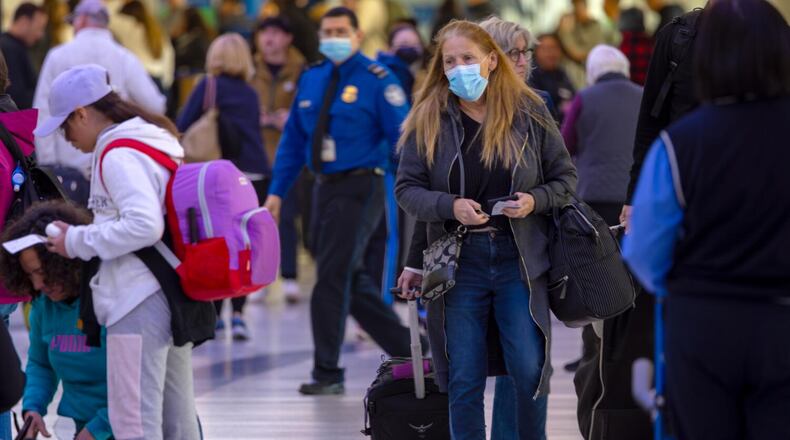 Passengers, with and without face mask, at Los Angeles International Airport on Wednesday, Jan. 10, 2024, in Los Angeles, California. (Irfan Khan/Los Angeles Times/TNS)