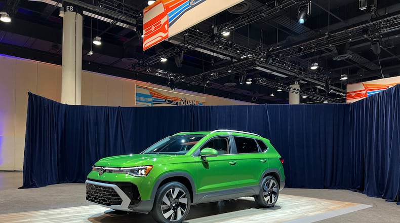 The 2025 Volkswagen Taos in moss green.
