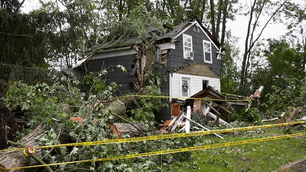 A home in Clark Mills, N.Y., that had a tree fall through it during a severe storm in the early morning, Sunday, June 22, 2025. (Tom Connolly/Spectrum News via AP)