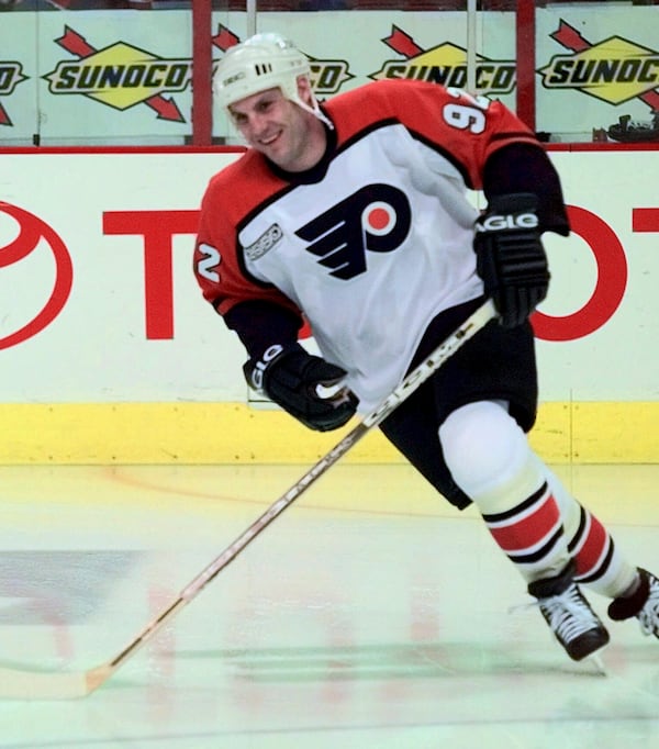 FILE - Philadelphia Flyers newly-acquired winger Rick Tocchet smiles during the pre-game skate Thursday, March 9, 2000 in Philadelphia. Tocchet was aquired in a trade with the Phoenix Coyotes on Wednesday.(AP Photo/Chris Gardner, file)